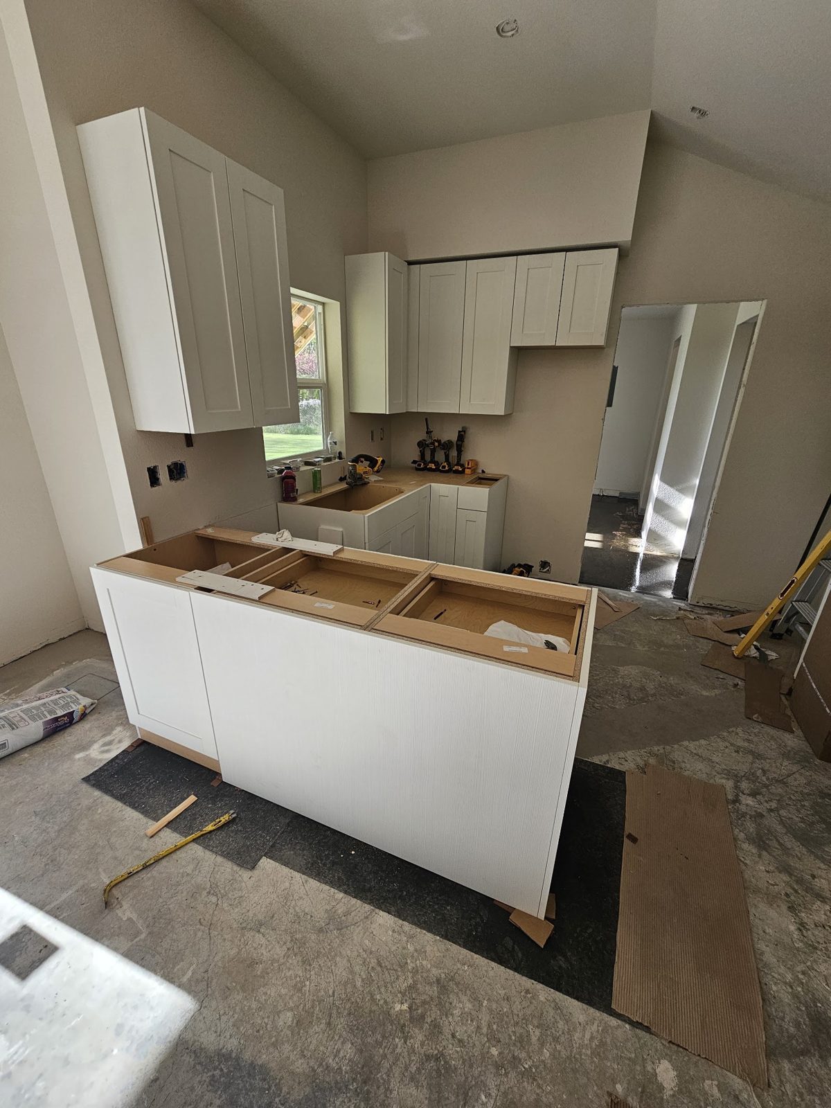 White kitchen remodel with new cabinets and island by Northwest Home Builders