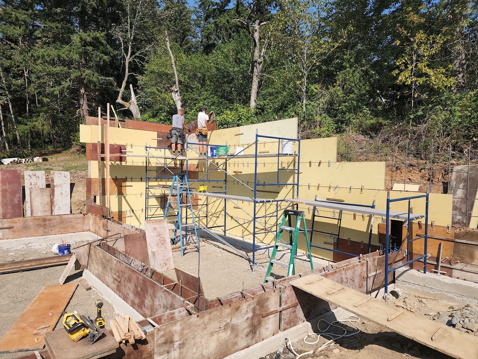 New foundation walls and framing on a hillside build site